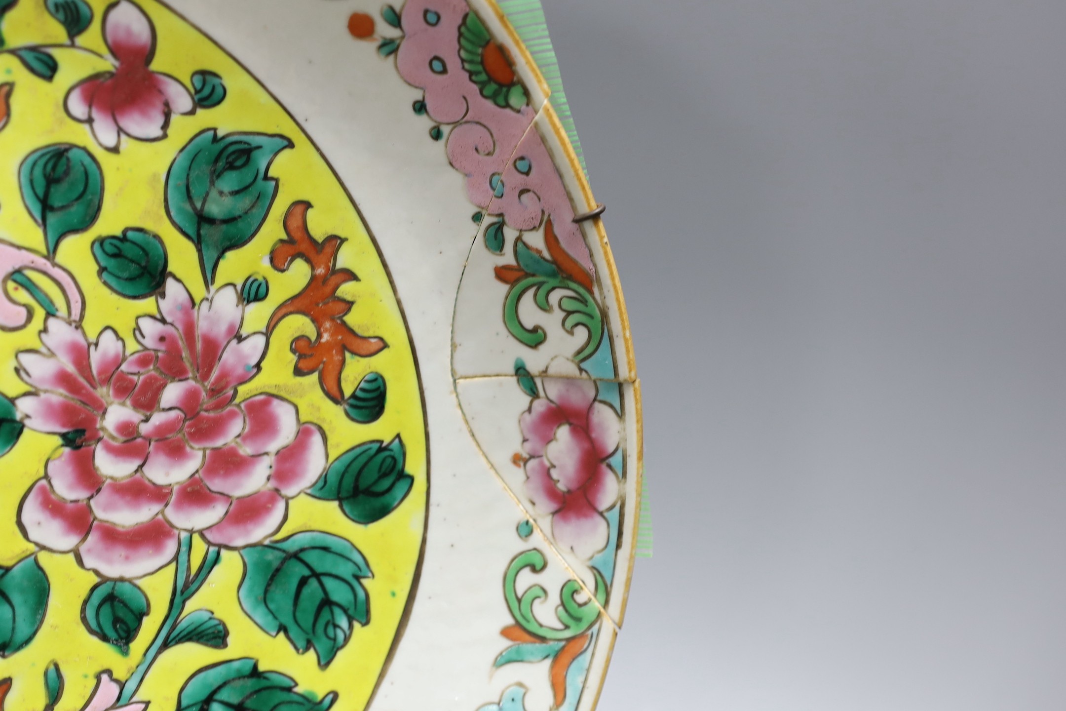 An early 20th century Chinese famille rose charger (a.f) and a Chinese famille verte dish. Largest 36cm